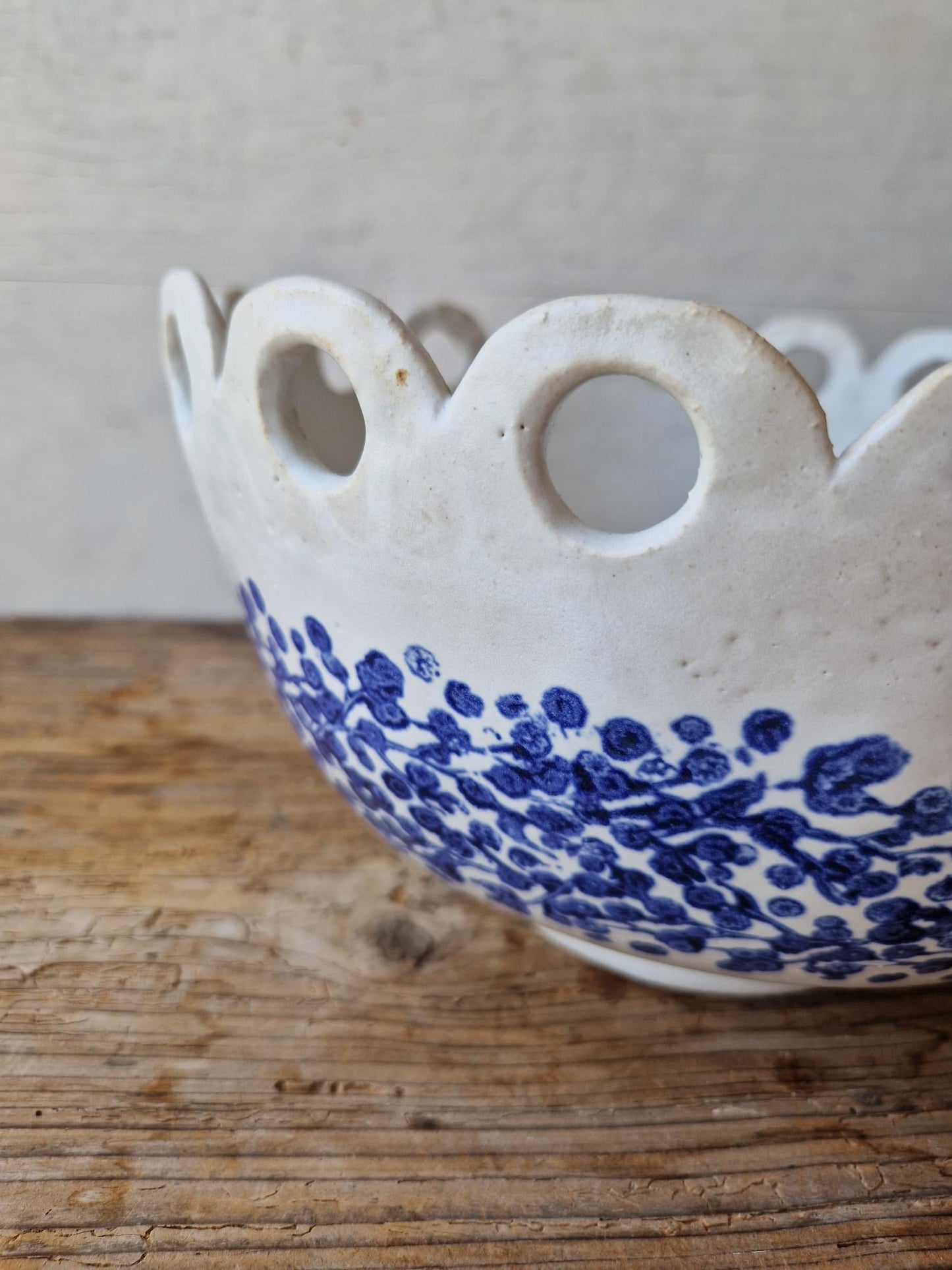Floral fruit bowl with scalloped rim