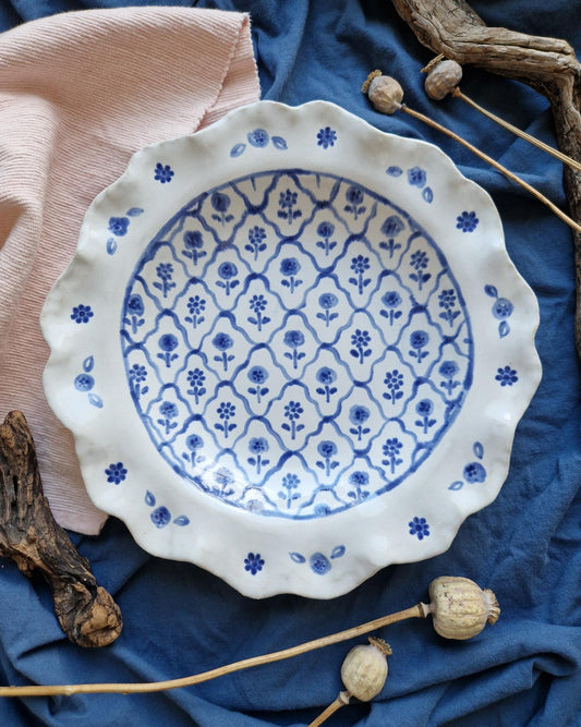 scalloped ceramic bowl with floral pattern