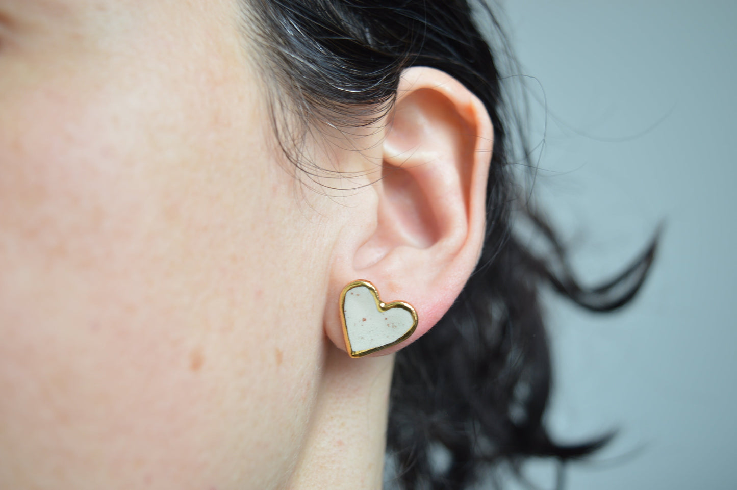 Gold rimmed heart studs