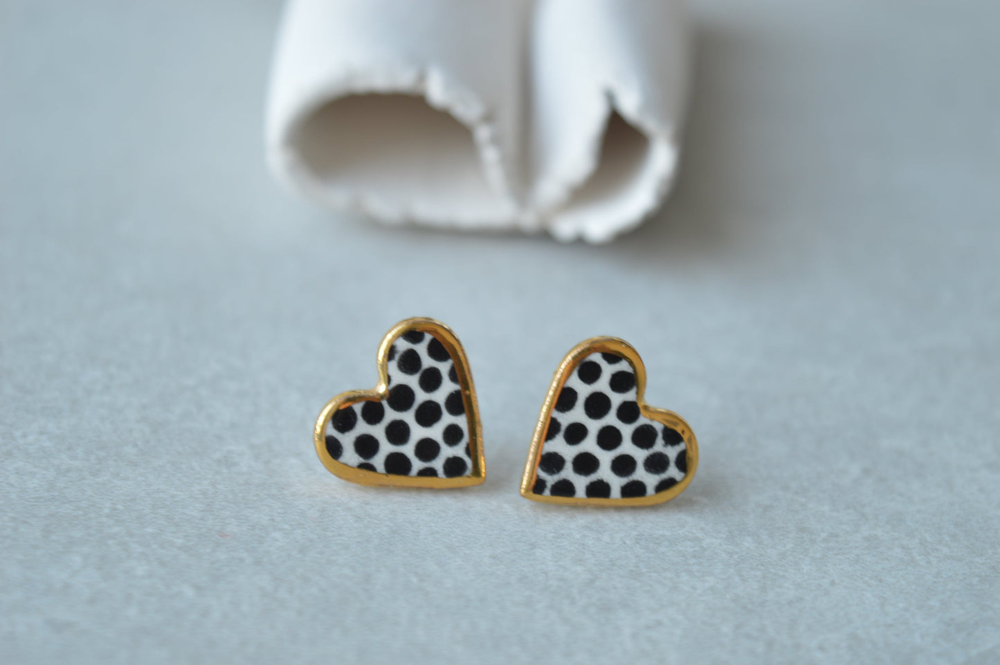 Gold rimmed heart studs