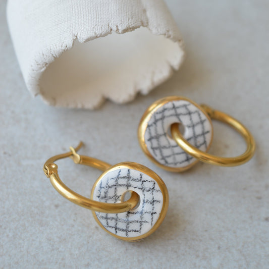 gold ceramic hoop earrings with geometric pattern