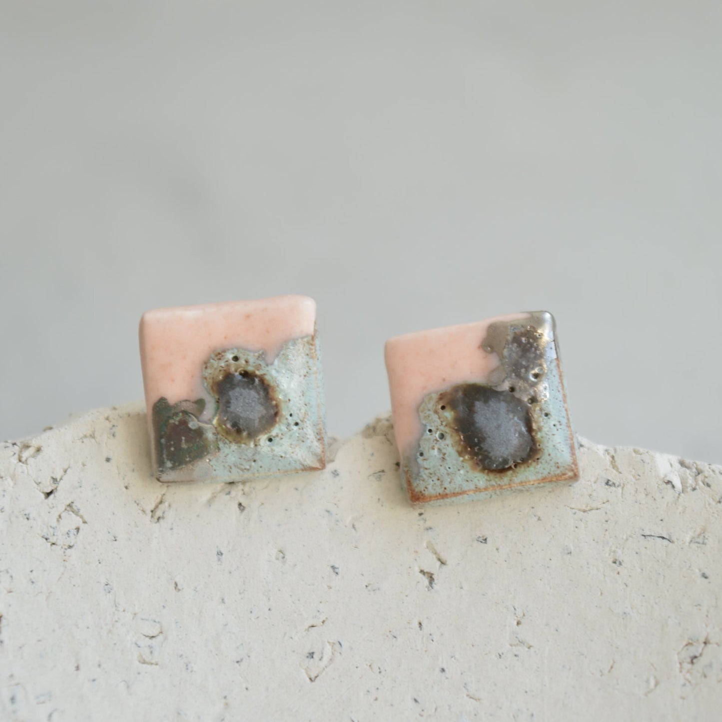 grey pink stud earrings