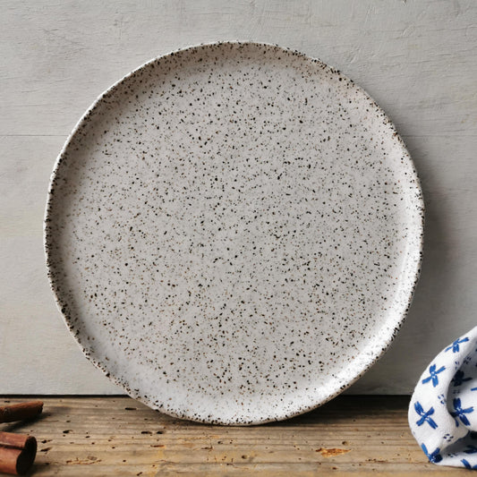 speckled white ceramic dessert plate