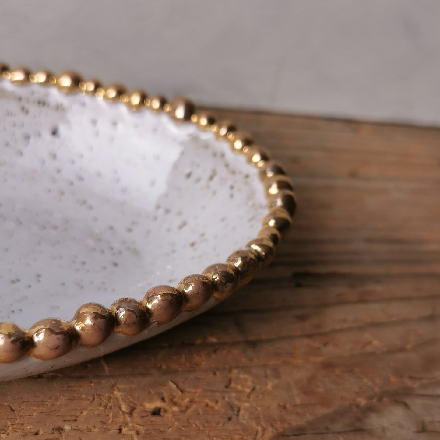 Small serving platter with gold pearls