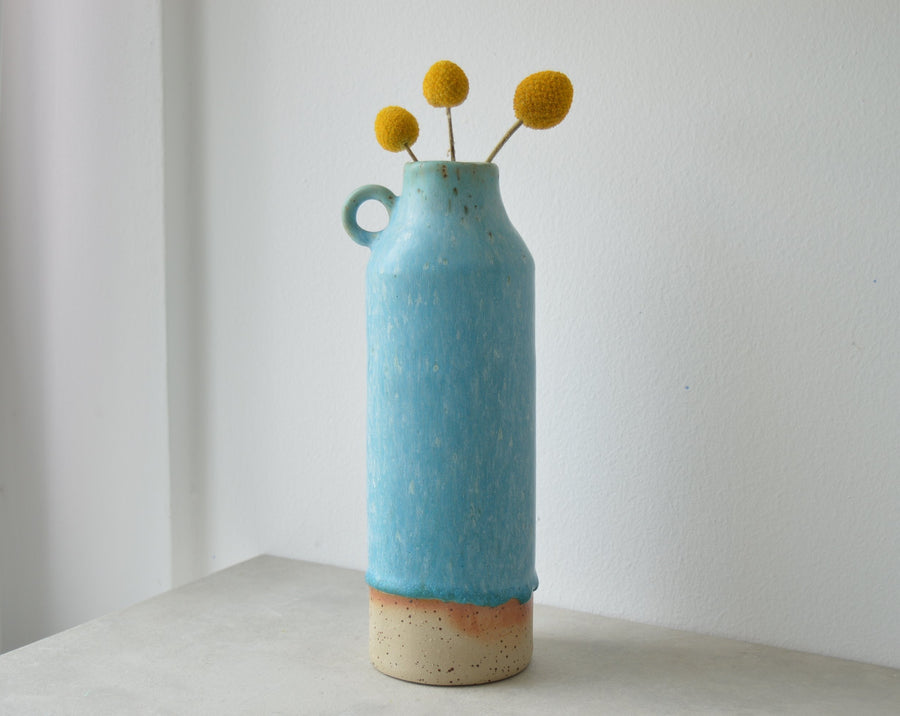 tall ceramic vase with handle