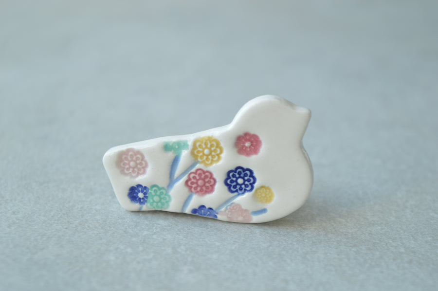 Colourful bird brooches