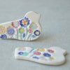 Colourful bird brooches
