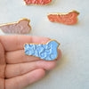 Bird brooches with gold rim